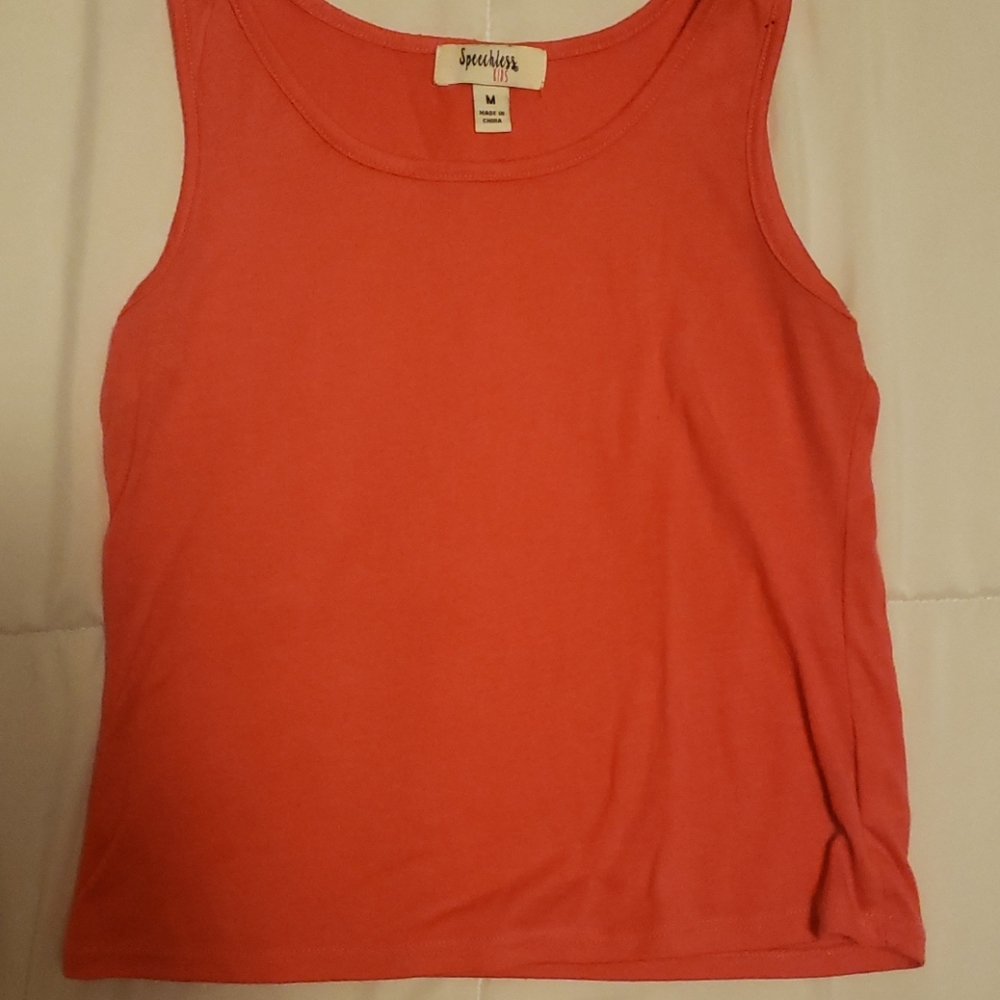 A spaghetti strapped shirt that comes wit/over top